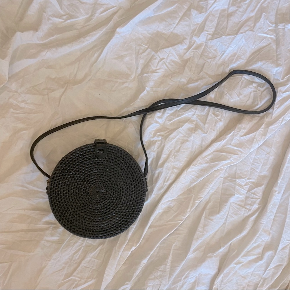 Handwoven black rattan straw circular crossbody bag